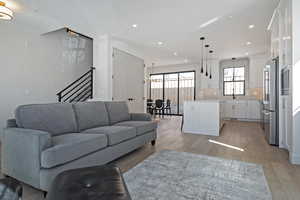 Living room featuring light wood-style floors and recessed lighting