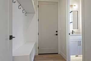 Mudroom featuring light wood-style floors