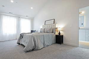 Bedroom with vaulted ceiling, carpet floors, and recessed lighting
