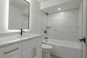 Bathroom featuring vanity and shower / bathtub combination