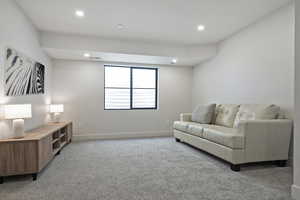 Sitting room featuring light colored carpet and recessed lighting