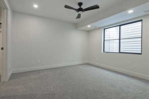 Unfurnished room featuring carpet floors, a ceiling fan, and recessed lighting