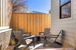 View of patio featuring a fire pit