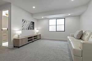 Sitting room featuring light carpet and recessed lighting