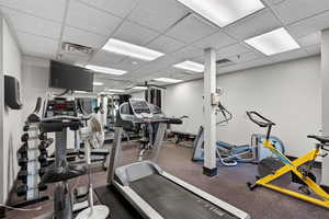 Workout area with a paneled ceiling