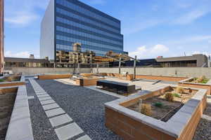View of yard featuring a garden and a patio area