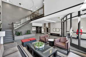 Community lobby with a high ceiling and recessed lighting