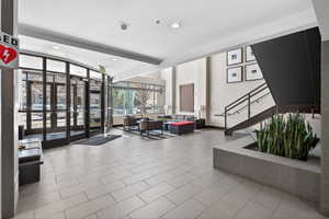 Common area with recessed lighting and beam ceiling