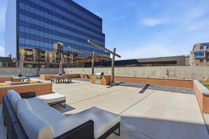 View of patio with an outdoor kitchen with living area