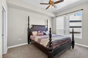 Bedroom with light carpet and ceiling fan