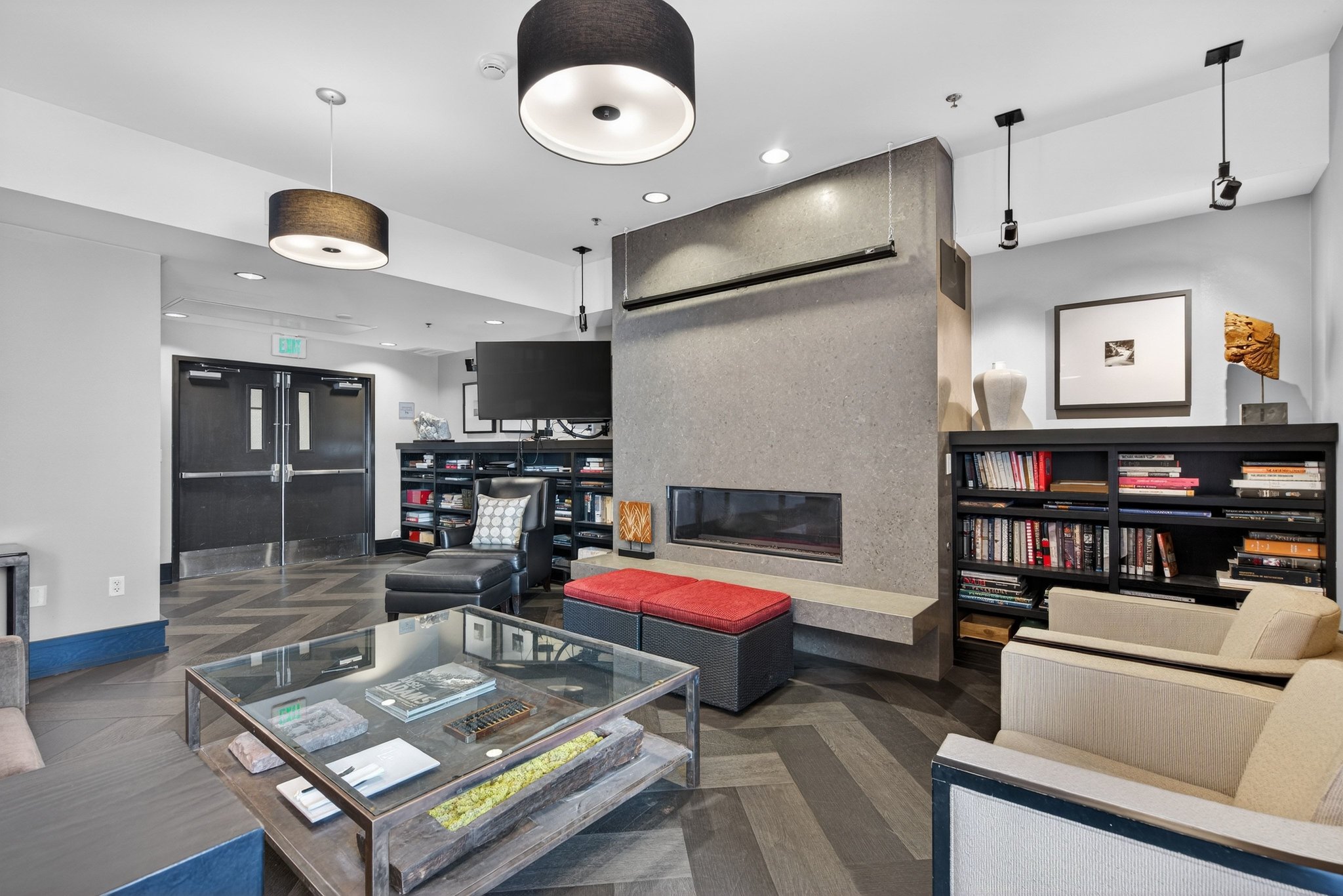 Living room with a fireplace, recessed lighting, and parquet flooring