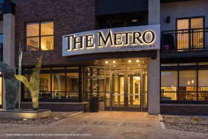 Property at twilight with view of commercial area