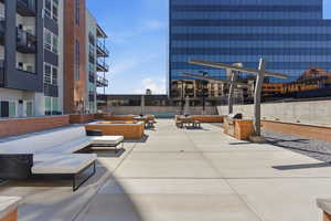View of property's community with outdoor seating