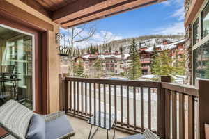 View of snow covered back of property