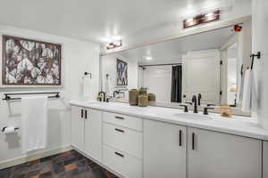 Full bathroom with double sinks