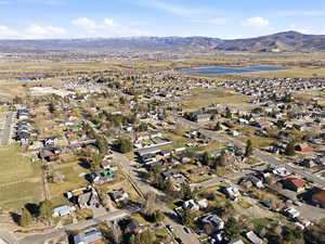 Aerial view of residential area featuring a mountainous background