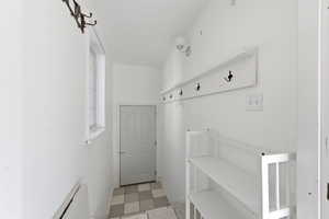 Mudroom with a baseboard radiator