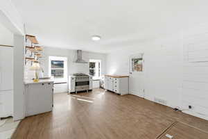 Unfurnished living room with light wood-style floors