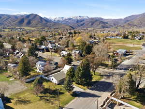 View of property location featuring nearby suburban area and a mountainous background