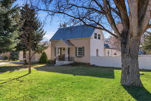 View of front of property with a shingled roof