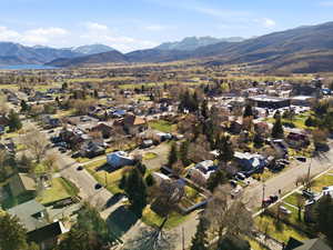 Aerial view of residential area featuring a mountainous background