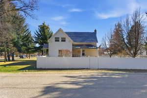 View of property exterior with a chimney
