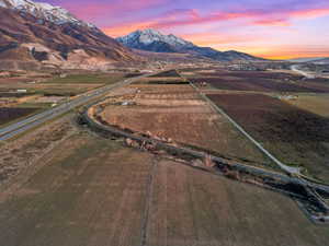 Aerial view at dusk of a view of rural / pastoral area, a mountain view, and agricultural area
