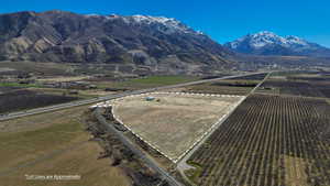 View of mountain backdrop featuring rural landscape and farmland