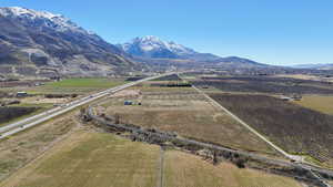Overview of rural landscape with abundant farmland and a mountain backdrop