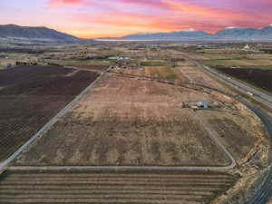 Aerial view at dusk of agricultural area, a rural view, and a mountain view