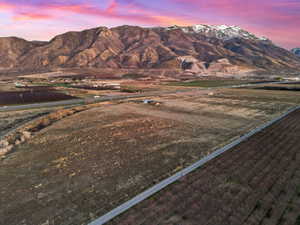View of mountain backdrop featuring rural landscape
