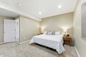 Carpeted bedroom featuring recessed lighting