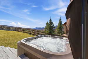 Exterior view of a hot tub and a mountainous background