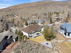 Aerial view of residential area featuring a mountainous background