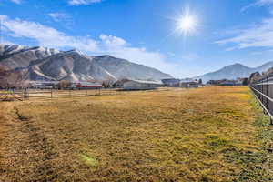 View of mountain backdrop with rural landscape