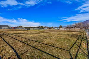 View of yard featuring an outbuilding and a mountain view