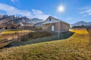 View of home's exterior with a mountain view and a fenced backyard