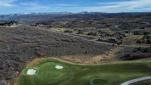 Bird's eye view of a mountain backdrop and a golf course