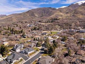 Aerial perspective of suburban area featuring a mountain backdrop