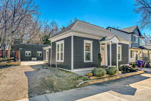 View of front of property with roof with shingles