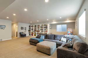Living room with recessed lighting and light colored carpet