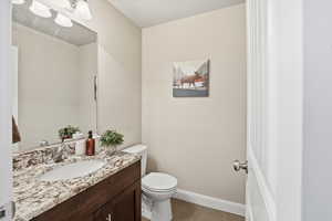 Bathroom featuring vanity and toilet