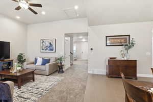 Living room featuring ceiling fan and recessed lighting
