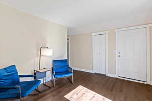 Unfurnished room with dark wood-type flooring