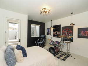 Carpeted bedroom featuring baseboards