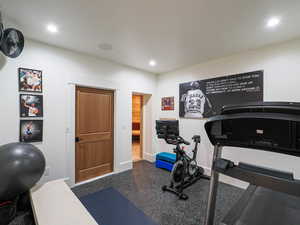 Workout room with baseboards and recessed lighting