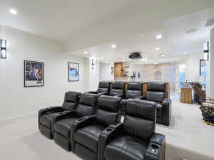 Home theater room featuring recessed lighting and light carpet