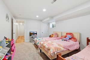 Bedroom featuring light carpet and recessed lighting