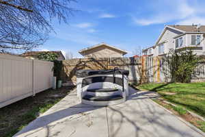 Fenced backyard featuring a patio