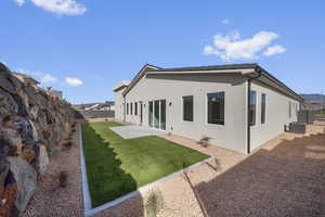 Back of property with a patio area, stucco siding, and a fenced backyard